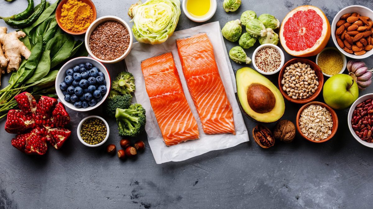 Healthy food such as salmon, berries, avocado and other fruit and veg