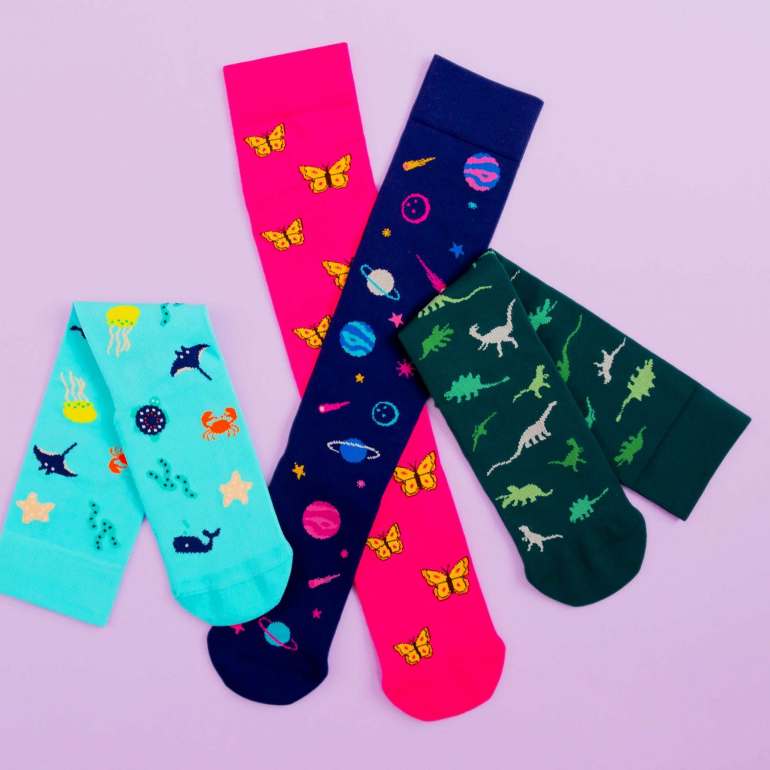 4 colourful (teal, navy, green and pink) compression socks