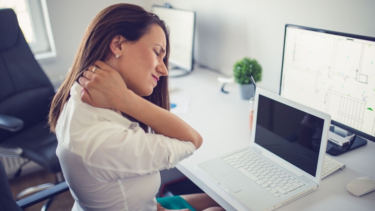 woman with neck pain at work